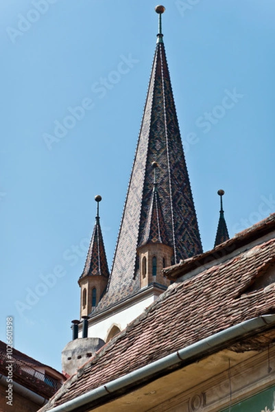 Fototapeta Fragment from the clock tower of Lutheran Cathedral of Saint Mary. It is a prominent landmark in Sibiu, Romania, one of the largest Gothic-style churches in Transylvania.
