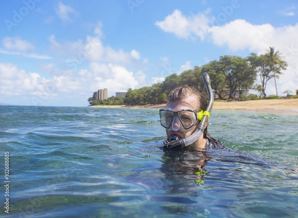 Obraz Man Snorkeling on a tropical island 