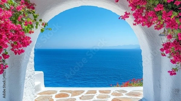 Fototapeta White Archway Framing a View of the Aegean Sea with Pink Bougainvillea