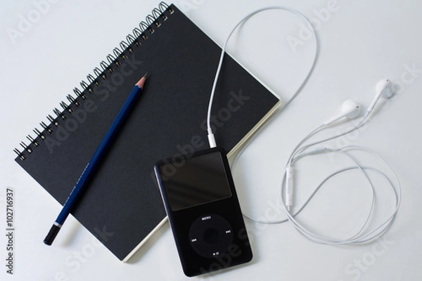 Obraz Desk with notebook, pencil and ipod