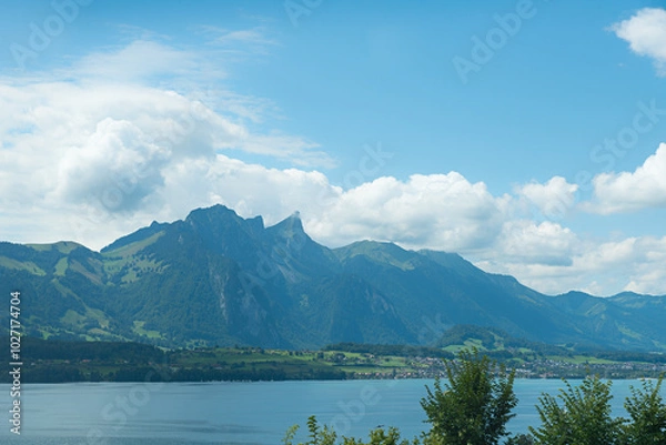 Obraz lake Thunersee with view to Stockhorn mountain, blue sky with clouds