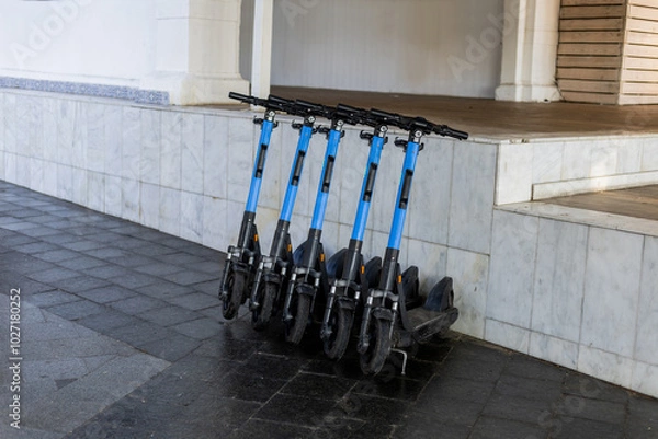 Obraz electric scooters lined up on the street