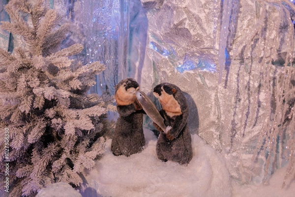 Fototapeta New Year's decorations, toys and garlands in fabulous settings. Toy animals for children in a public place.