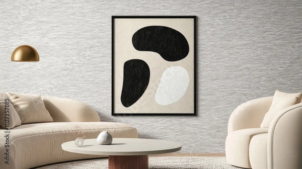 Fototapeta Framed Abstract Wall Art Mockup with Black and White Shapes on Beige Canvas in Modern Living Room with Gray Textured Wallpaper