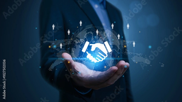 Obraz Businessman hand presents a holographic global partnership concept. network of organizations to create value, partnerships, Business collaboration strategies, suppliers, and other stakeholders.