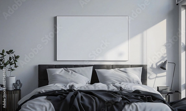 Fototapeta Interior of a cozy bedroom with a white canvas on the wall, warm colors.