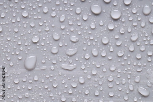 Fototapeta Water drops on gray background, top view