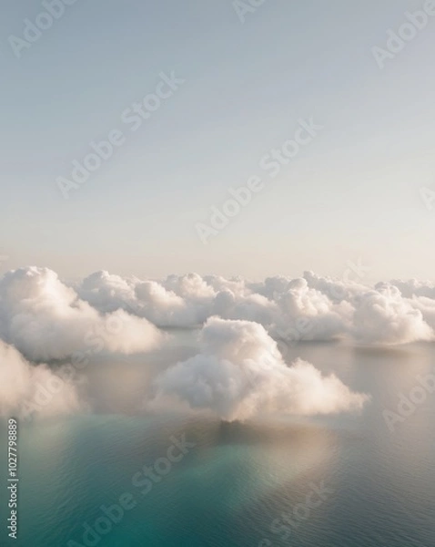 Fototapeta Scenic View Above Fluffy Clouds Over the Ocean.