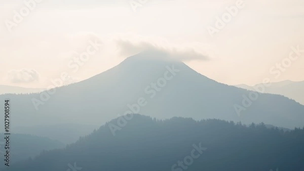 Fototapeta Serene Mountain View Amidst Soft Clouds