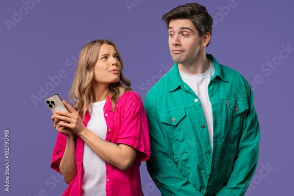 Fototapeta Suspicious man Spying On girlfriend Chats With Smartphone. Jealousy, Curiosity