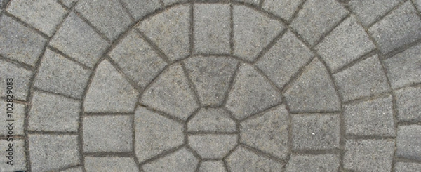 Fototapeta Paving Stone laid in pattern/ Stone laid in circular pattern. Good for textures and backgrounds.