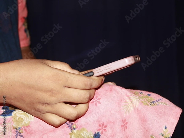 Obraz Woman's hand holding using smart phone with blank screen, Copy space for Text. mobile app design and advertising, online marketing