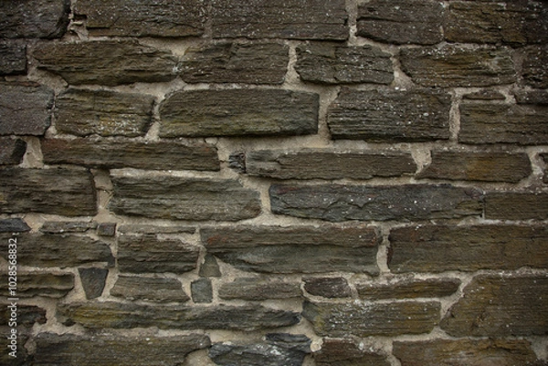 Fototapeta wall of flat stones as a background, close up