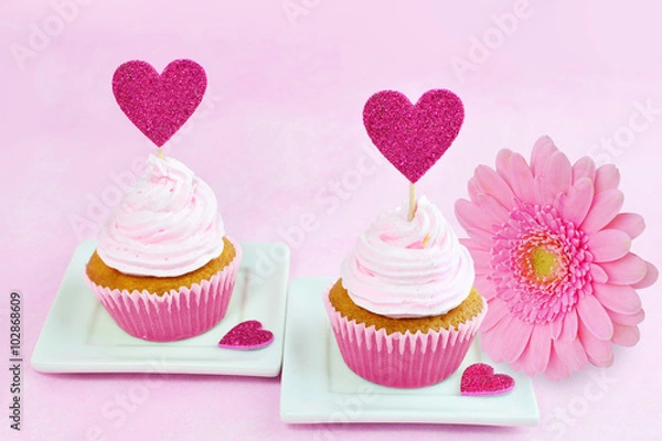 Fototapeta Pink greeting card with cupcake, red heart and pink gerbera daisy.