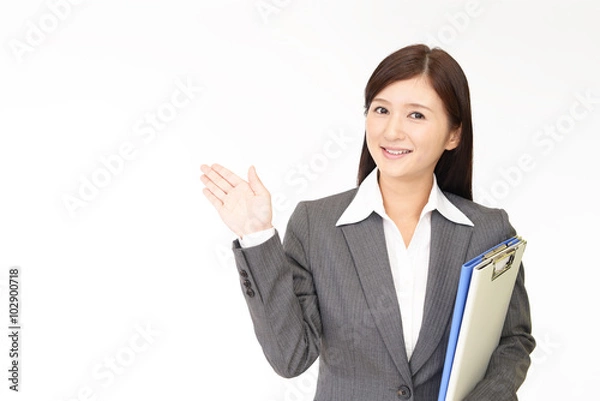 Fototapeta 案内するビジネスウーマン