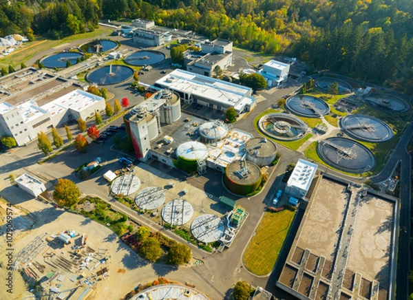 Fototapeta A large industrial area with many buildings and a lot of water tanks
