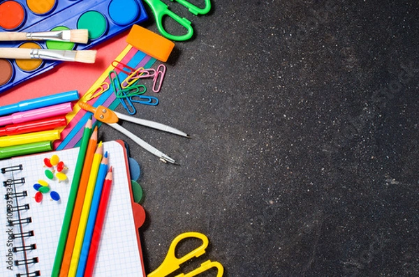Obraz School supplies on dark table