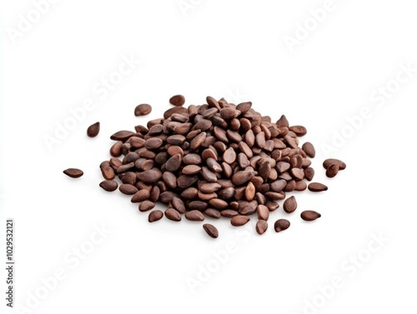Fototapeta A pile of brown seeds isolated on a white background.