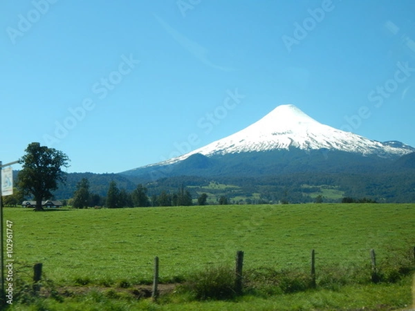 Obraz Green fileds with volcano