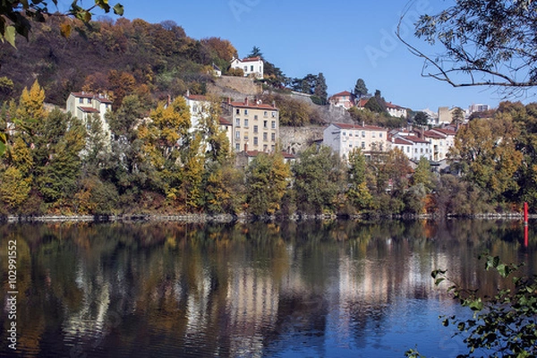 Fototapeta Riverside with houses in Europe in France