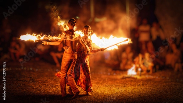Obraz The enchanting fire dancers beautifully showcase their talent with fascinating flames during the performance.