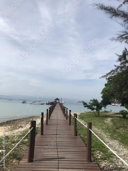 Fototapeta Crystal-clear water, sandy beach, gentle waves