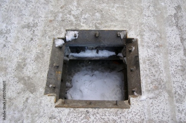 Fototapeta Technological opening in a monolithic concrete slab prepared for structural installation.