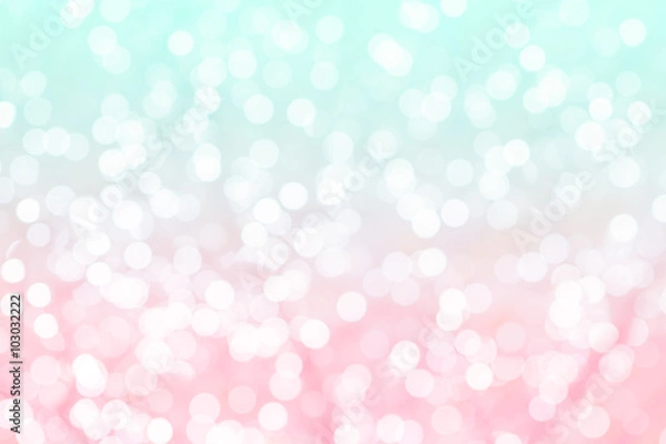 Fototapeta Colorful background with natural bokeh texture and defocused sparkling lights. Turquoise and pink texture with background with twinkling lights. Vintage and pastel colors