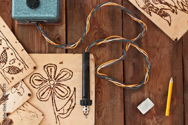 Obraz Pyrography workshop. A pyrography tool and a floral model.
