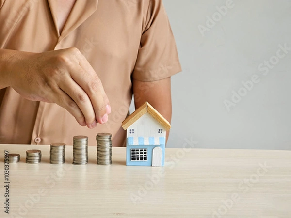 Obraz Save money to invest in purchasing a house, with copy space.