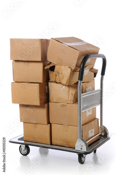 Obraz Plain brown boxes stacked haphazardly on small cart