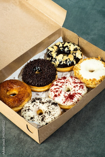 Obraz a box of donuts with various flavors