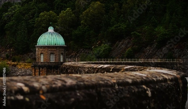 Obraz This photograph was taken on 10th August 2024 at Caban coch dam, England. This shot was caught in a moving car, driving over a raised bendy bridge at the dam.