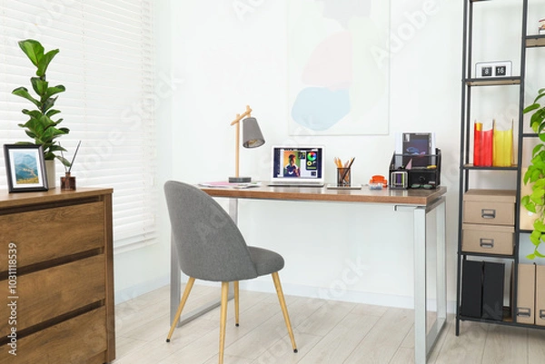 Fototapeta Fashion designer`s workplace with laptop and different supplies on table