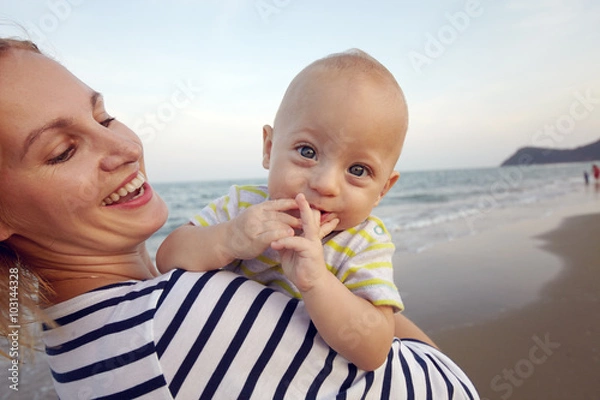 Obraz Lifestyle photo normal family with baby boys on the ocean coast