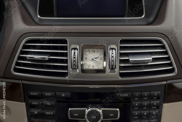 Obraz Modern car dashboard with clock and ventilation. Interior detail.