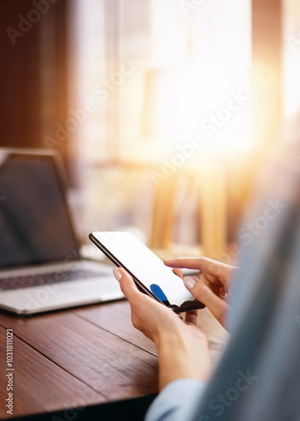 Fototapeta Woman pointing on smartphone screen, chatting in social networks, meeting website, searching internet, sending sms, using text messenger or online banking