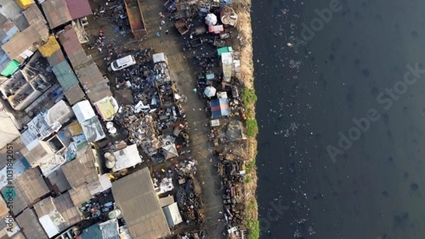 Fototapeta Ghana, Accra,   AGBOGBLOSHIE drone view Odaw River the largest landfill illegal dump in Africa for electronic and plastic waste from the Western world. mountain of toxic waste, environmental disaster 