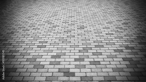 Fototapeta Vignette Perspective View of Monotone Gray Brick Stone Street Road. Sidewalk, Pavement Texture Background