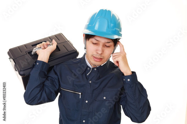 Fototapeta 疲れた表情の労働者