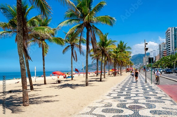Obraz Ipanema beach with palms and mosaic of sidewalk in Rio de Janeiro, Brazil. Ipanema beach is the most famous beach of Rio de Janeiro, Brazil. Cityscape of Rio de Janeiro.
