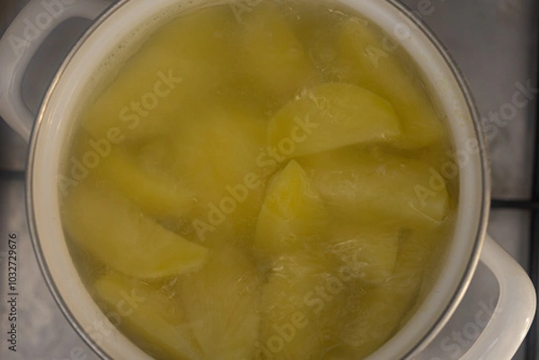 Fototapeta closeup of boiling potato in pan