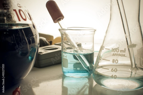 Fototapeta science laboratory test tubes with periodic table background