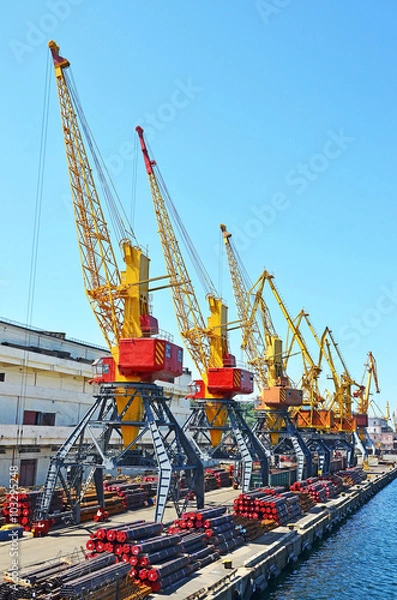 Fototapeta Cargo crane and pipe stack