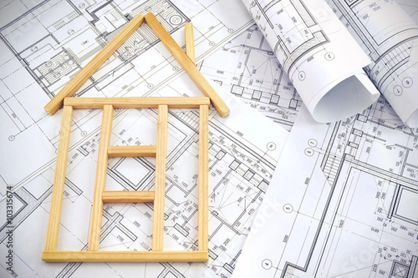 Fototapeta House made of wooden sticks and project drawings