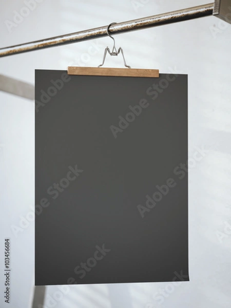 Fototapeta Trouser hanger with black paper sheet. 3d rendering