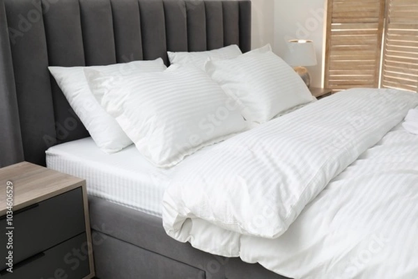 Fototapeta Comfortable bed with clean linens and pillows indoors