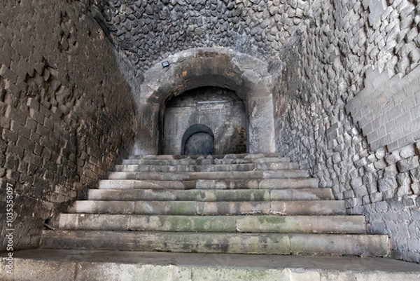 Fototapeta Wander through the ancient stone pathways of the Arles Roman Era Amphitheater, where cave-like passages and carved steps create a mystical journey. Each step echoes with history, inviting exploration
