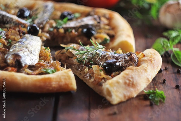 Obraz Pizza with sardine, anchovy and black olives. Selective focus.
