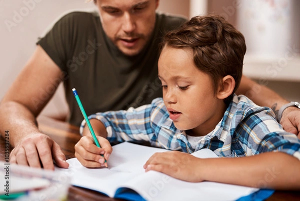 Fototapeta Learning, writing and father with child for knowledge, education and creative lesson at house. Home school, notebook and happy dad teaching boy at table writing for development, homework and studying